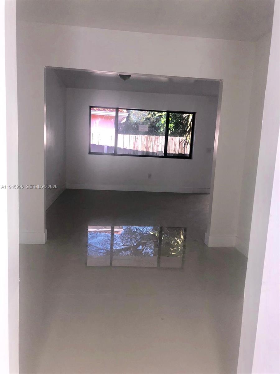 660 82nd Street, Unit 4 Miami Beach, FL 33141 - Photo 9 of 11 a view of an empty room with a window