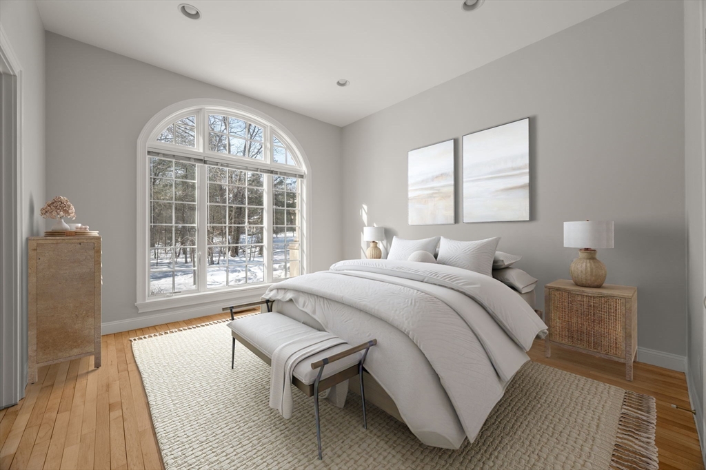 20 Flint Road Concord, MA 01742 - Photo 14 of 34 a spacious bedroom with a bed and wooden floor