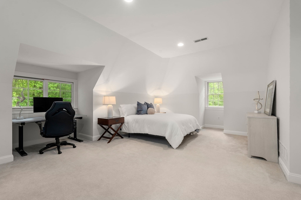 20 Flint Road Concord, MA 01742 - Photo 18 of 34 a bedroom with a bed a table and a chair
