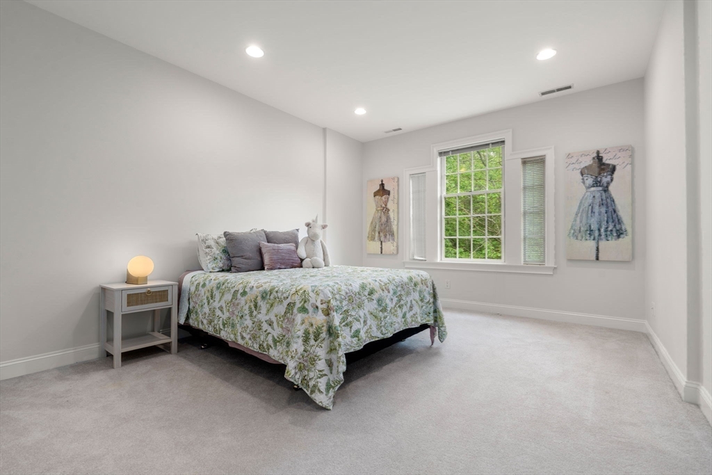 20 Flint Road Concord, MA 01742 - Photo 20 of 34 a bed room with a bed and a window