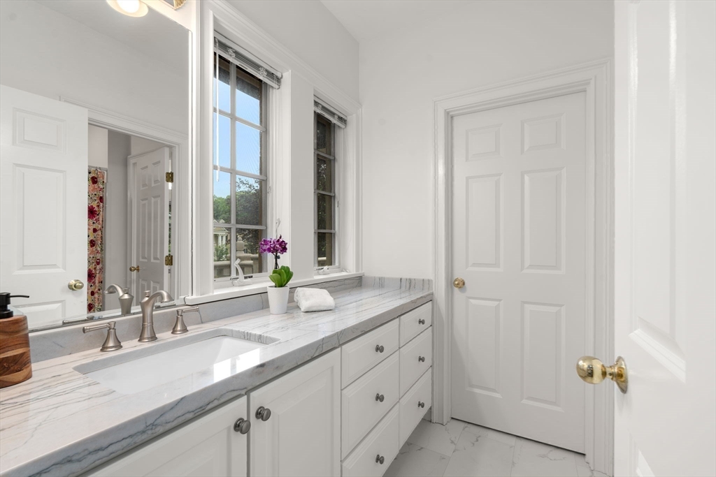 20 Flint Road Concord, MA 01742 - Photo 21 of 34 a bathroom with double vanity and a mirror