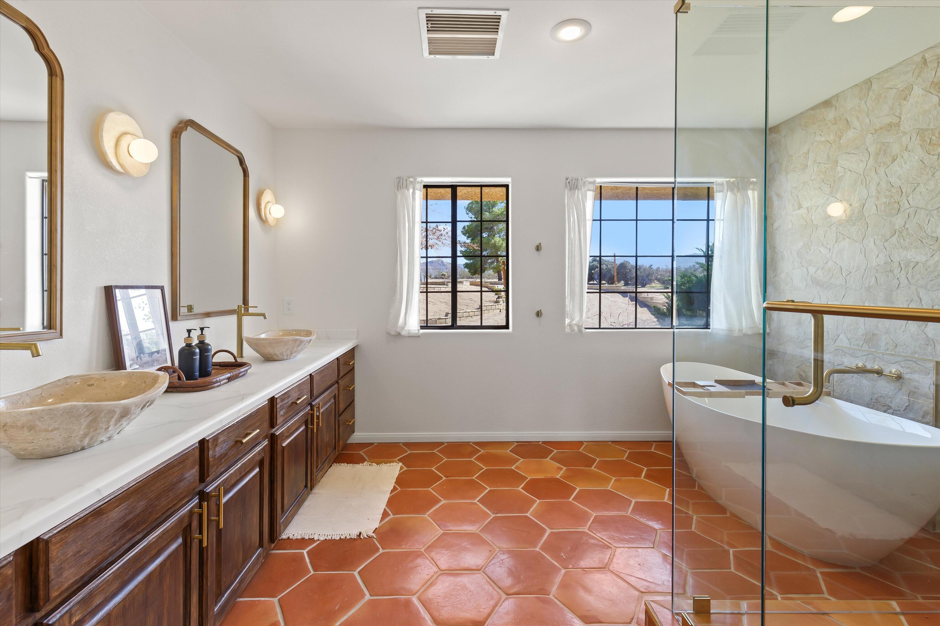62850 Dennis Avenue Joshua Tree, CA 92252 - Photo 20 of 39 a bathroom with a sink a toilet and mirror
