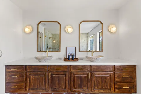 a view of a room with water heater and wooden floor