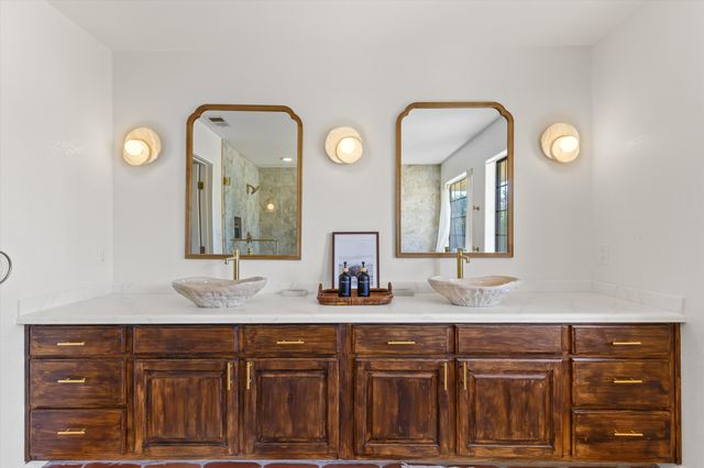 a view of a room with water heater and wooden floor