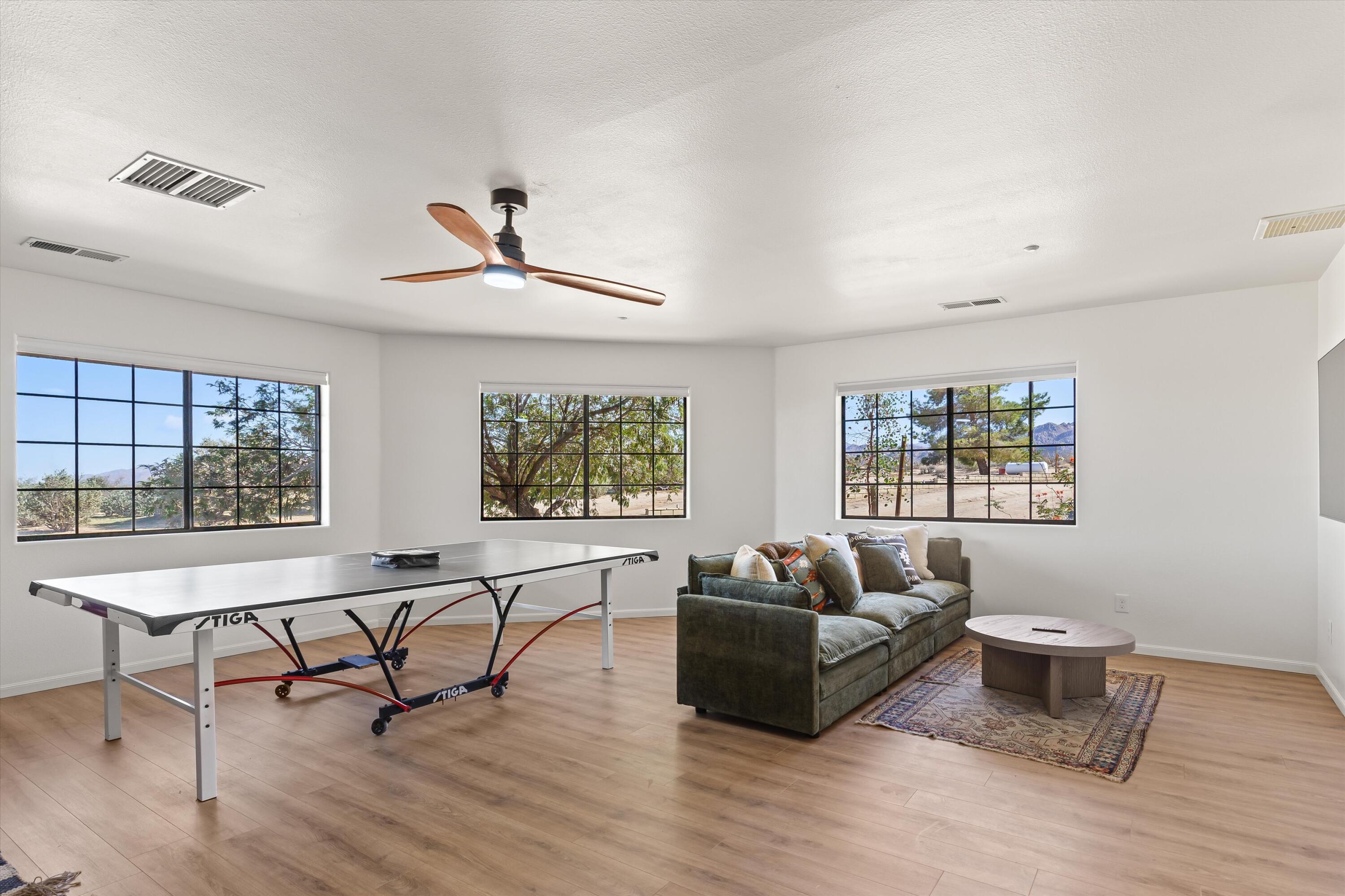 62850 Dennis Avenue Joshua Tree, CA 92252 - Photo 27 of 39 a living room with furniture and a window