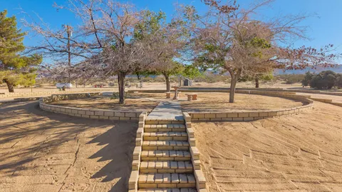 a front view of a building with a yard