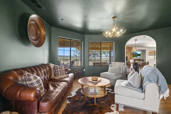 a living room with furniture and a large window