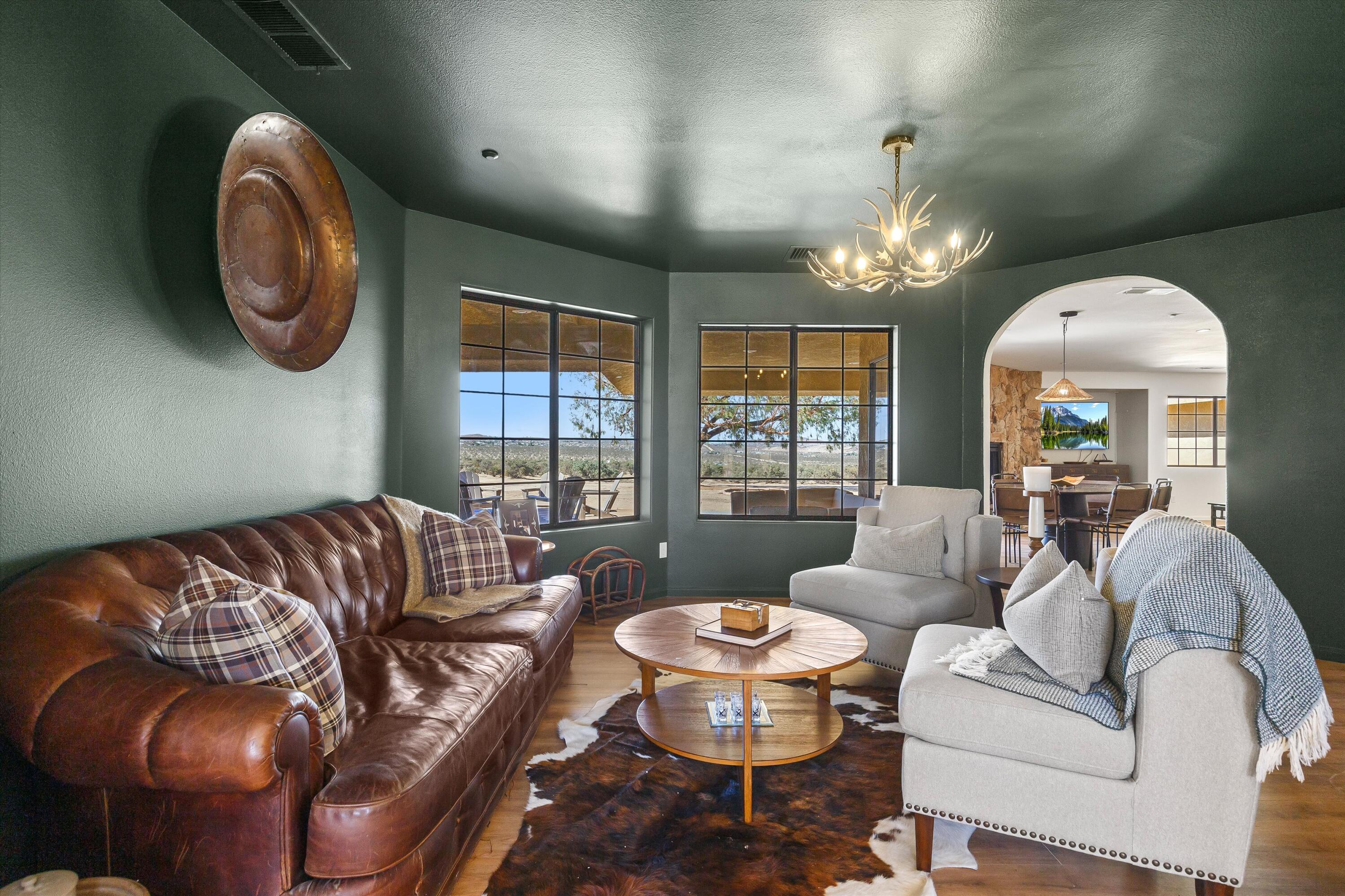 62850 Dennis Avenue Joshua Tree, CA 92252 - Photo 5 of 39 a living room with furniture and a large window