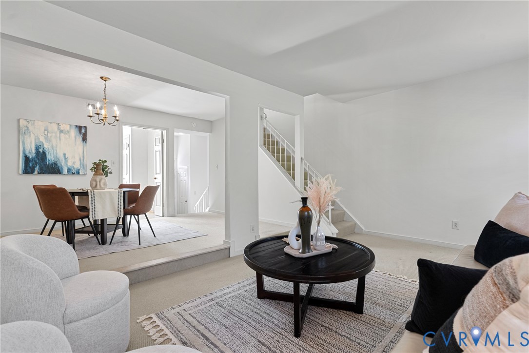 11612 Timberly Waye Henrico, VA 23238 - Photo 12 of 37 a living room with furniture and a chandelier