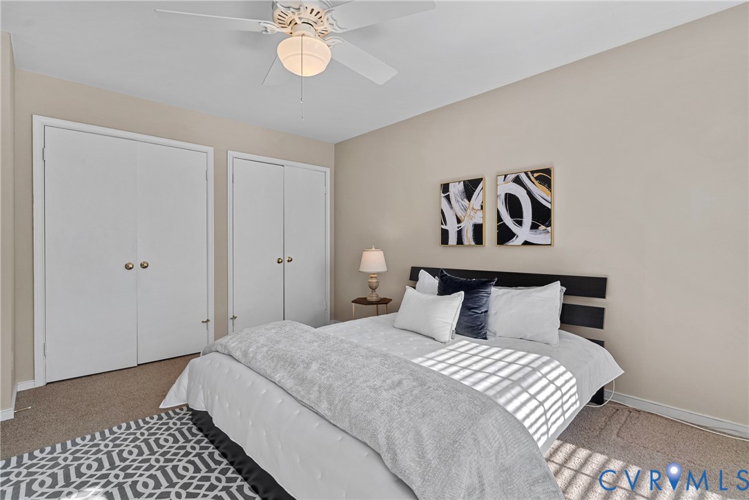 11612 Timberly Waye Henrico, VA 23238 - Photo 14 of 37 a bedroom with a bed and lamps