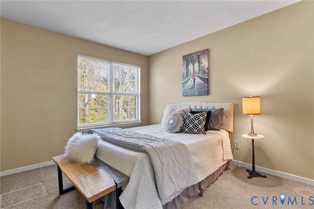 11612 Timberly Waye Henrico, VA 23238 - Photo 18 of 37 a bedroom with a bed and wooden floor