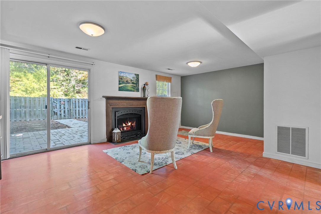 11612 Timberly Waye Henrico, VA 23238 - Photo 20 of 37 a living room with furniture a window and a fireplace