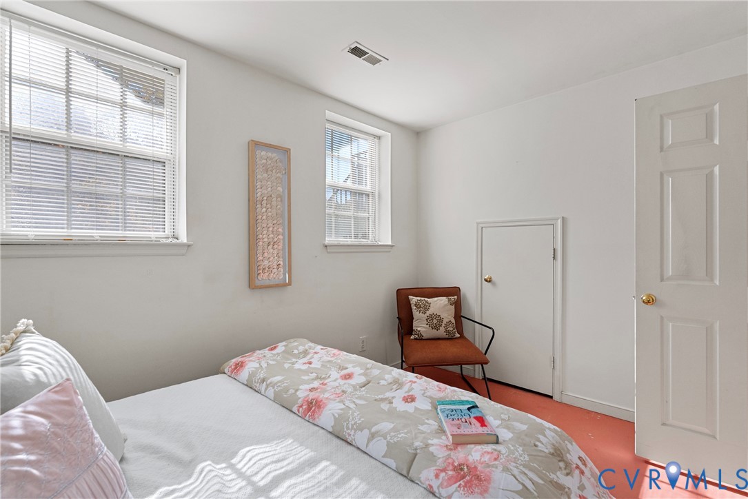11612 Timberly Waye Henrico, VA 23238 - Photo 25 of 37 a bedroom with a bed and a window with wooden floor