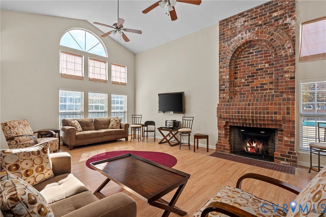 11612 Timberly Waye Henrico, VA 23238 - Photo 29 of 37 a living room with furniture a fireplace and a flat screen tv