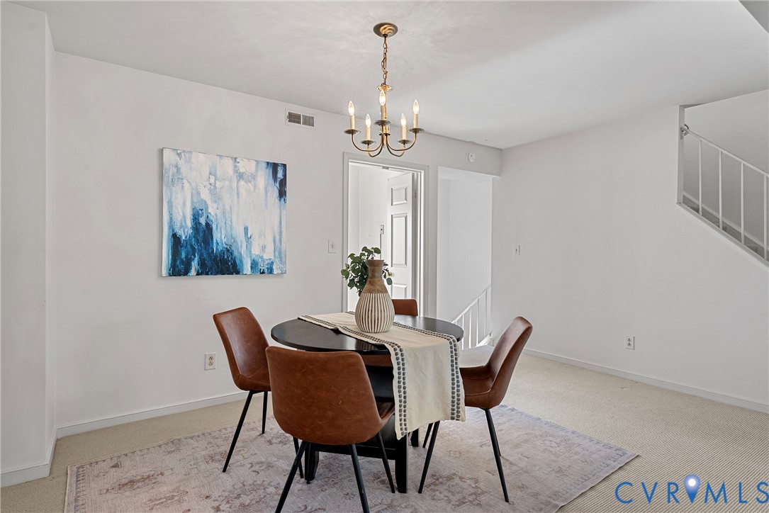 11612 Timberly Waye Henrico, VA 23238 - Photo 6 of 37 a view of a dining room with furniture and chandelier