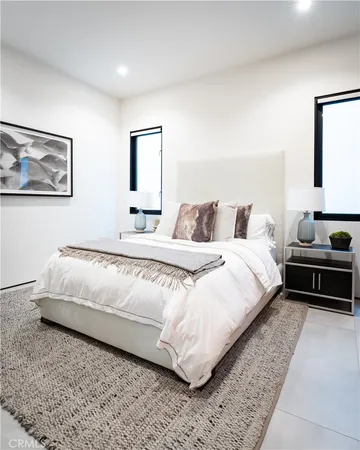 a bedroom with a bed and a couch
