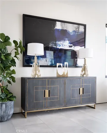 a kitchen with a potted plant on the counter and cabinets