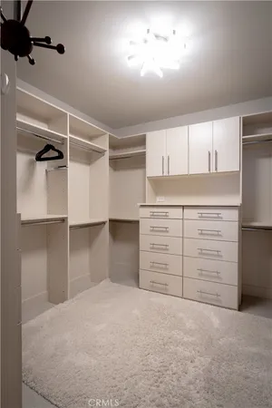 a bed room with a bed and a night stand