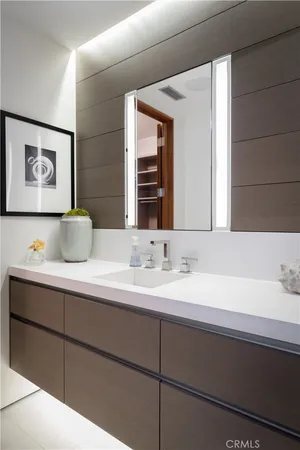 a view of walk in closet and cabinet