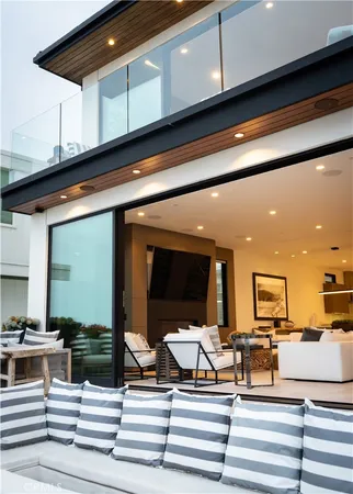 a kitchen view with wooden floor and furniture