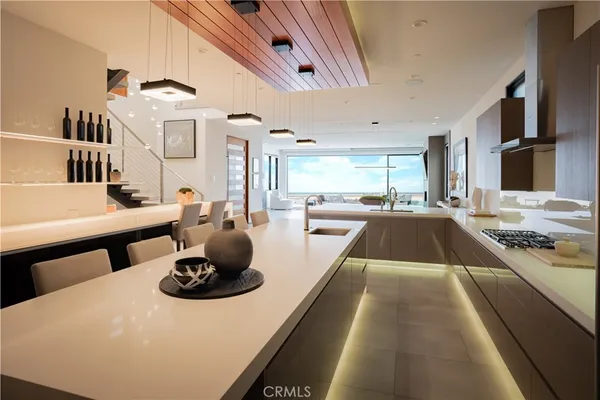 a large kitchen with a table and chairs