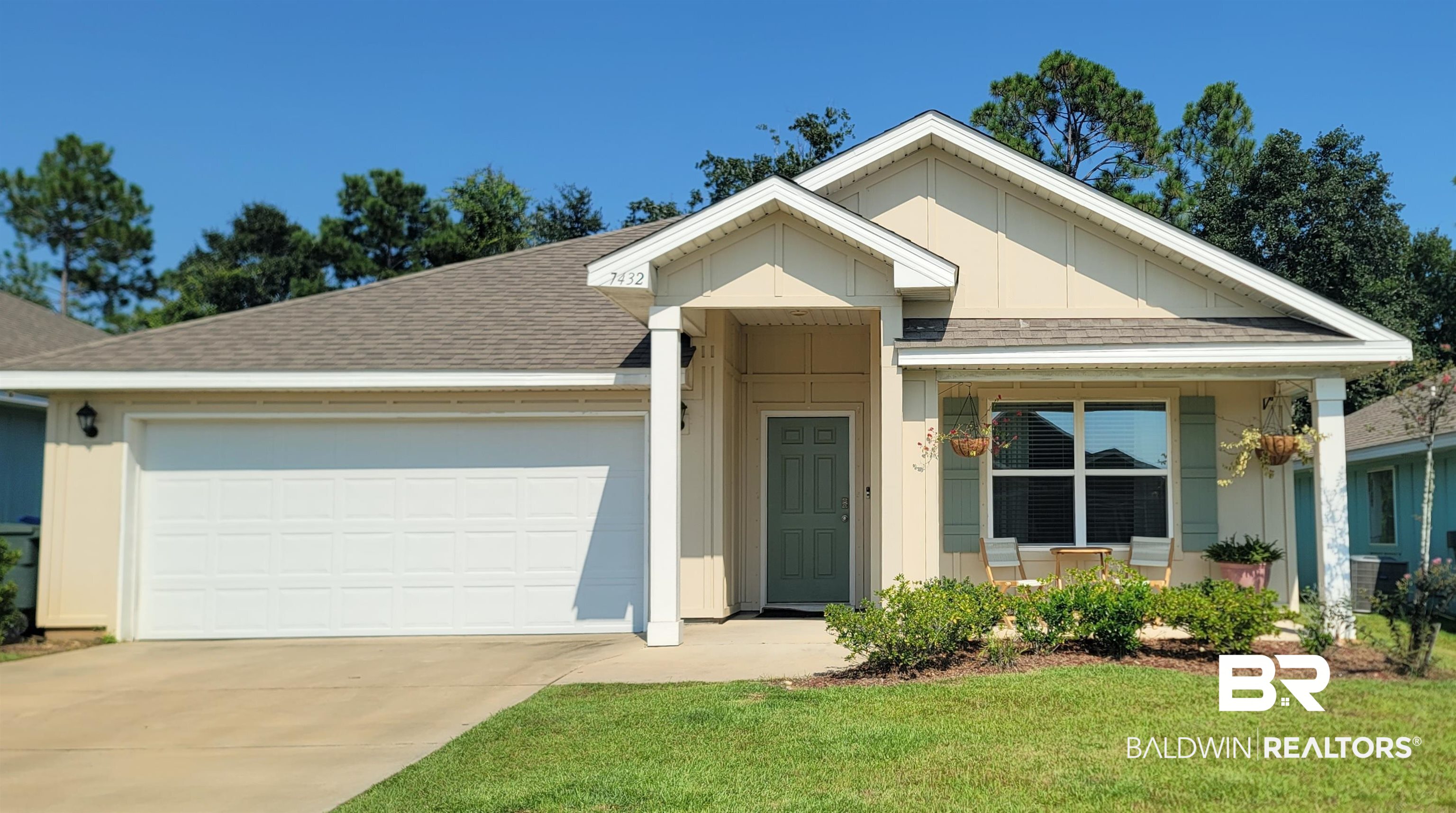 7432 Coppin Drive Foley, AL 36535 - Photo 1 of 18 Ranch-style house featuring roof with shingles, an attached garage, driveway, and a front yard