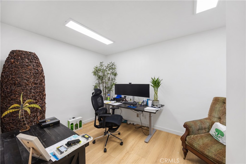 14128 Paramount Boulevard Paramount, CA 90723 - Photo 19 of 42 a workspace with furniture and a couch