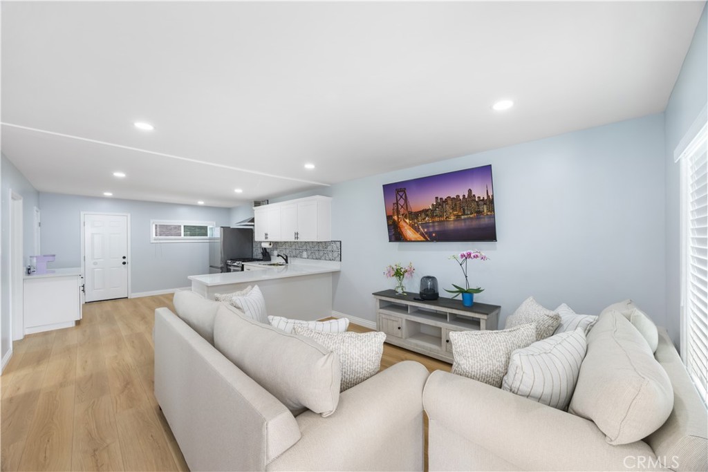 14128 Paramount Boulevard Paramount, CA 90723 - Photo 27 of 42 a living room with furniture and a view of kitchen