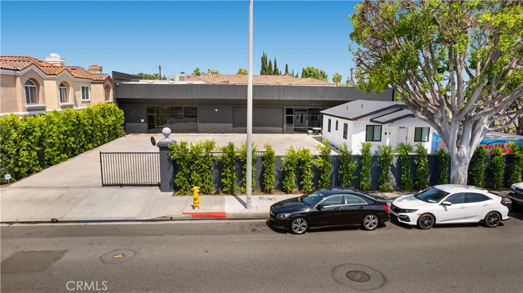 14128 Paramount Boulevard Paramount, CA 90723 - Photo 35 of 42 a car parked in front of a house