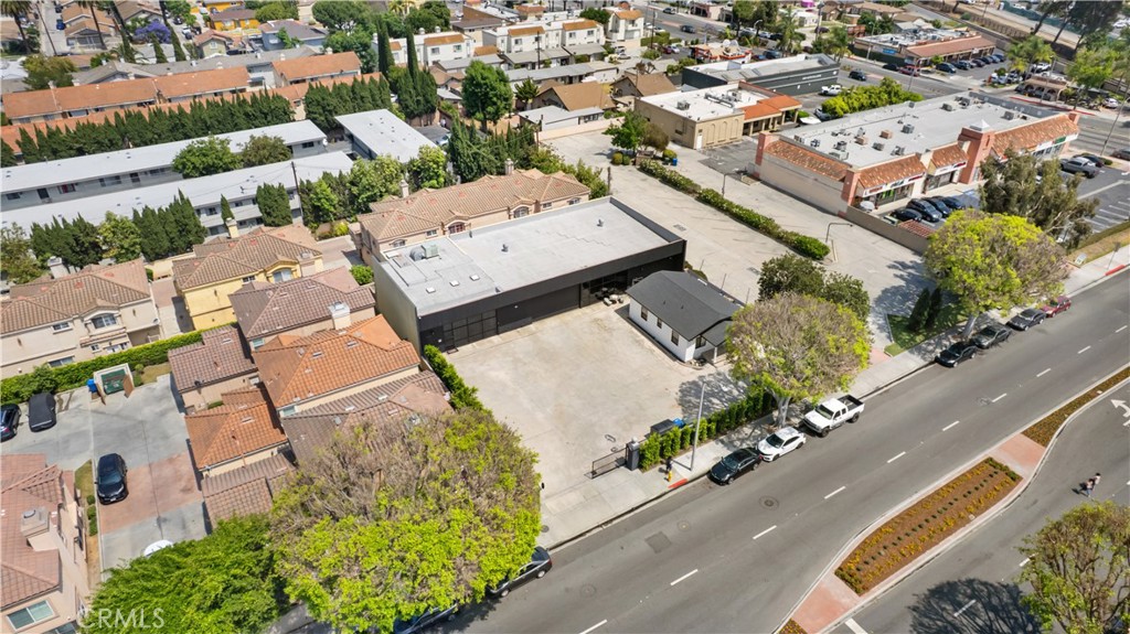 14128 Paramount Boulevard Paramount, CA 90723 - Photo 38 of 42 an aerial view of a city with lots of residential buildings