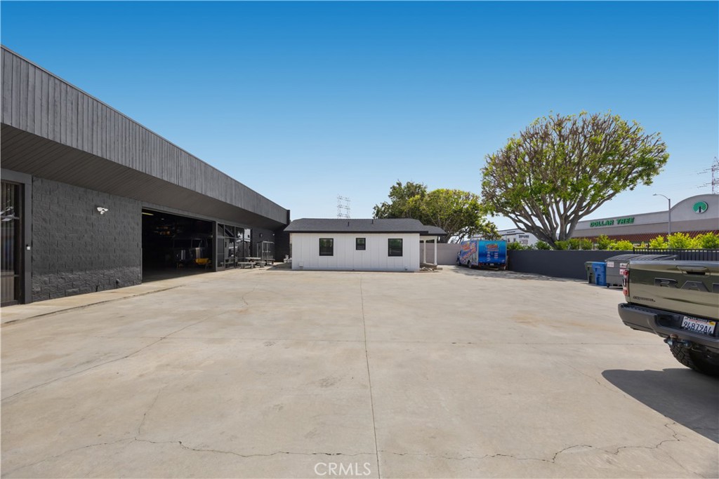 14128 Paramount Boulevard Paramount, CA 90723 - Photo 4 of 42 a view of a house with a yard and sitting area