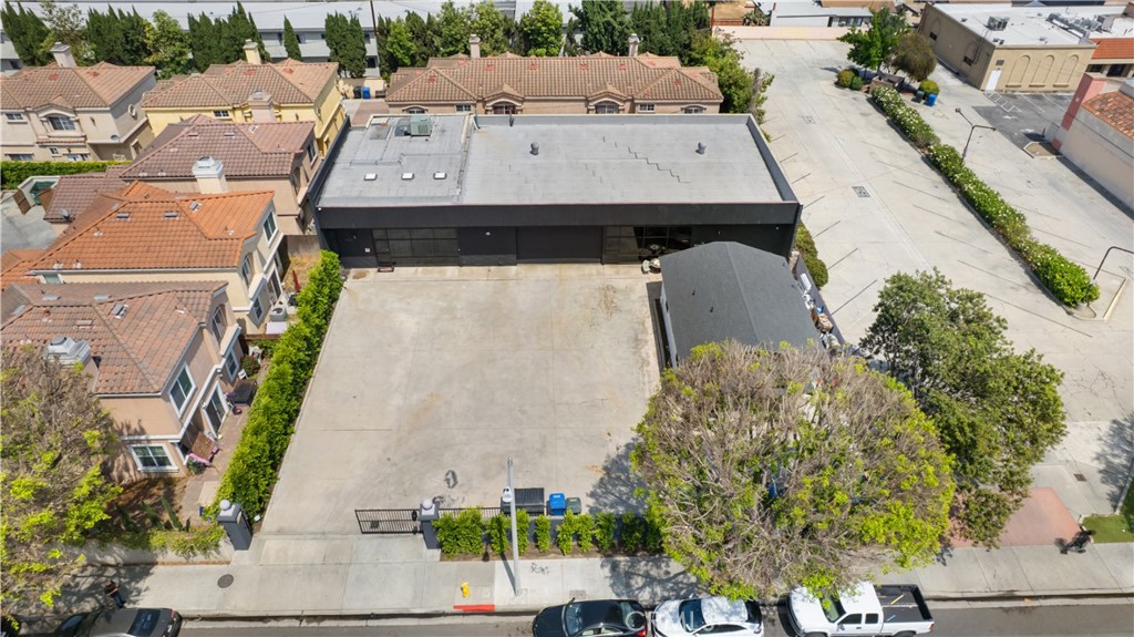 14128 Paramount Boulevard Paramount, CA 90723 - Photo 6 of 42 an aerial view of a house with a yard and seating space