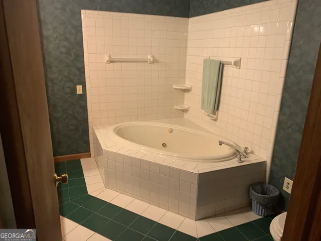 a bathroom with a tub and sink