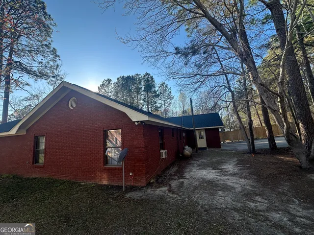 a backyard of a house with lots of green space