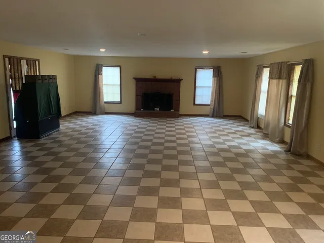 a view of a livingroom with a black and white checkered floor