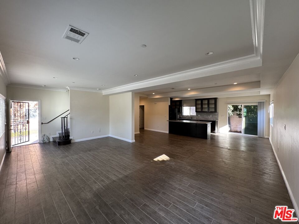 24842 Frampton Avenue Harbor City, CA 90710 - Photo 16 of 26 a view of an empty room with window and wooden floor