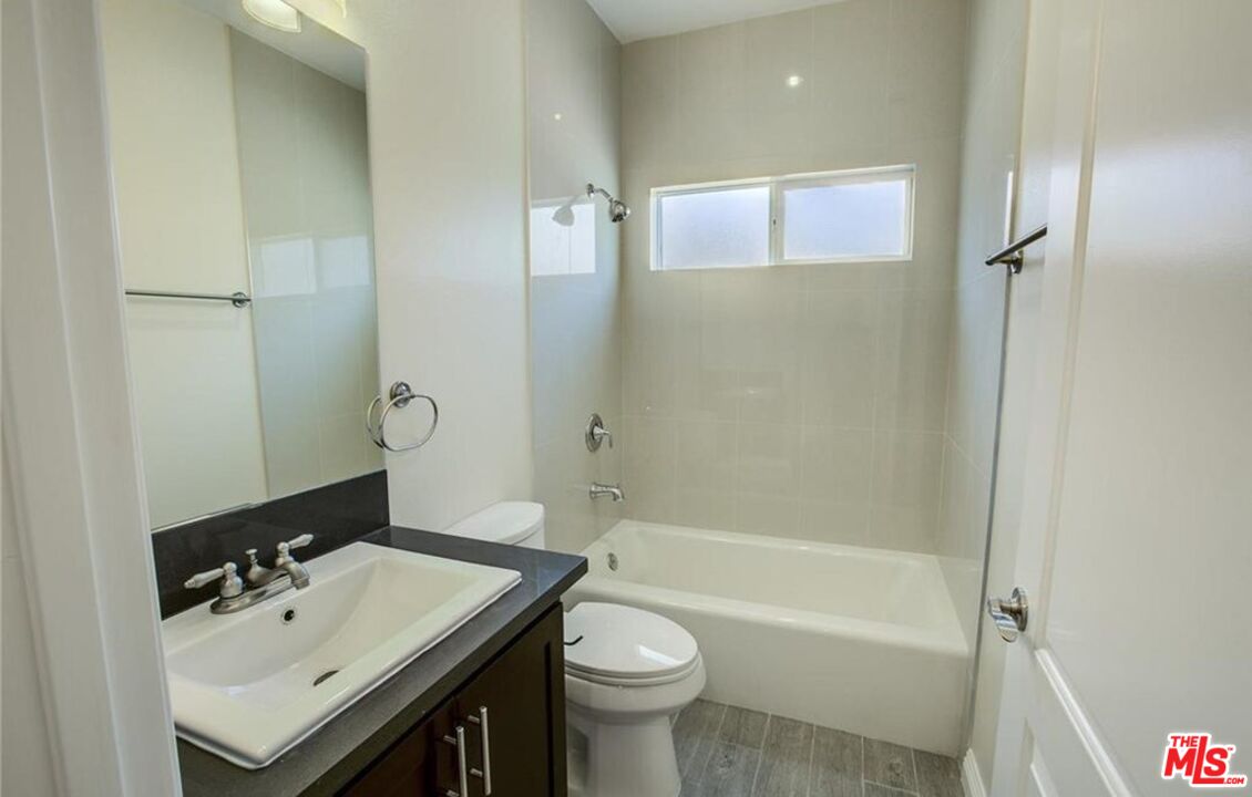 24842 Frampton Avenue Harbor City, CA 90710 - Photo 6 of 26 a bathroom with a sink a toilet and shower