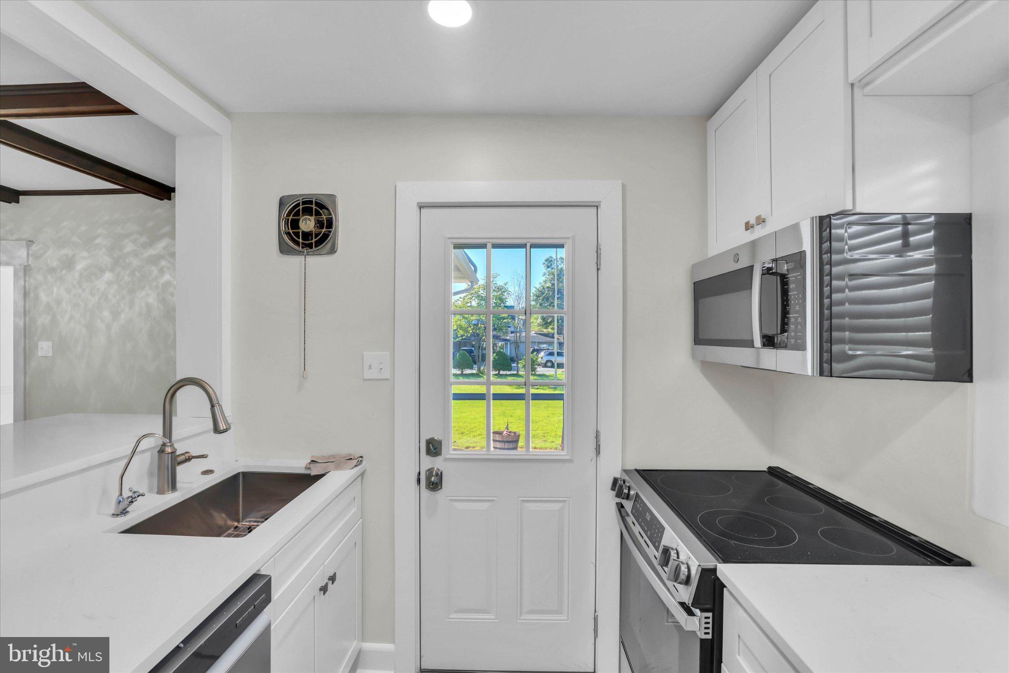 222 Berlin Road North Lindenwold, NJ 08021 - Photo 32 of 42 Bright kitchen with outdoor access.