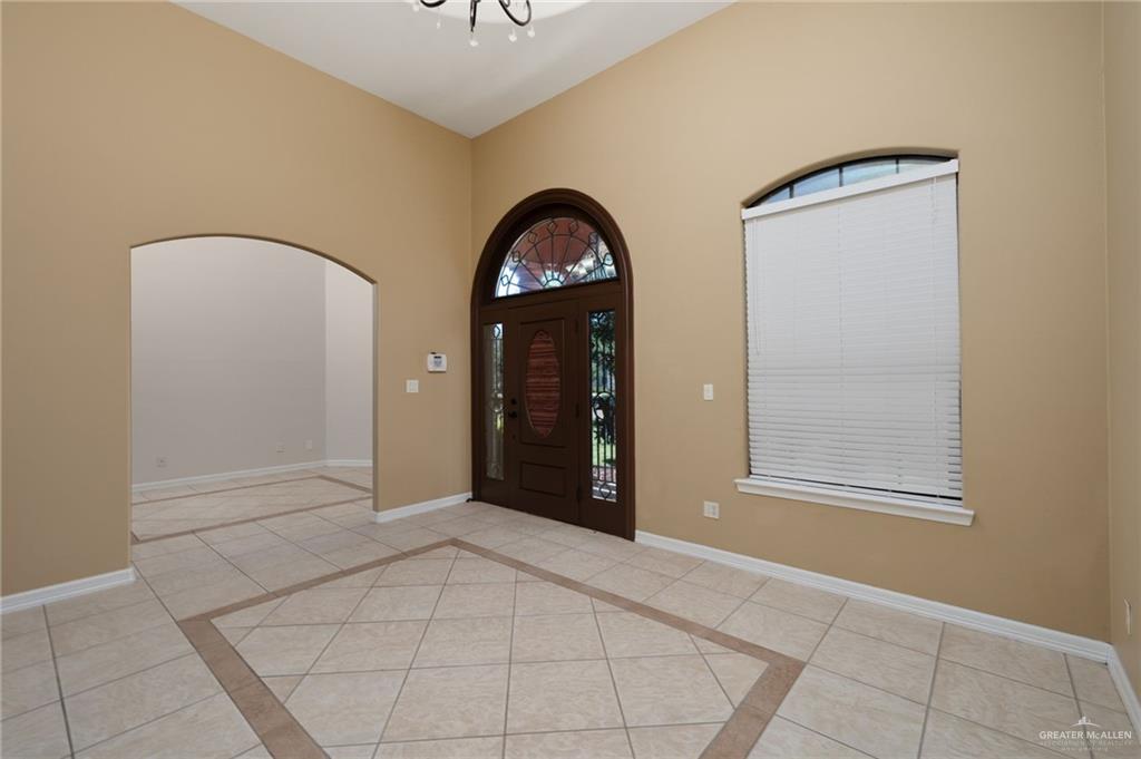 504 Orchard Court Weslaco, TX 78596 - Photo 3 of 24 a view of a livingroom with a large mirror and window