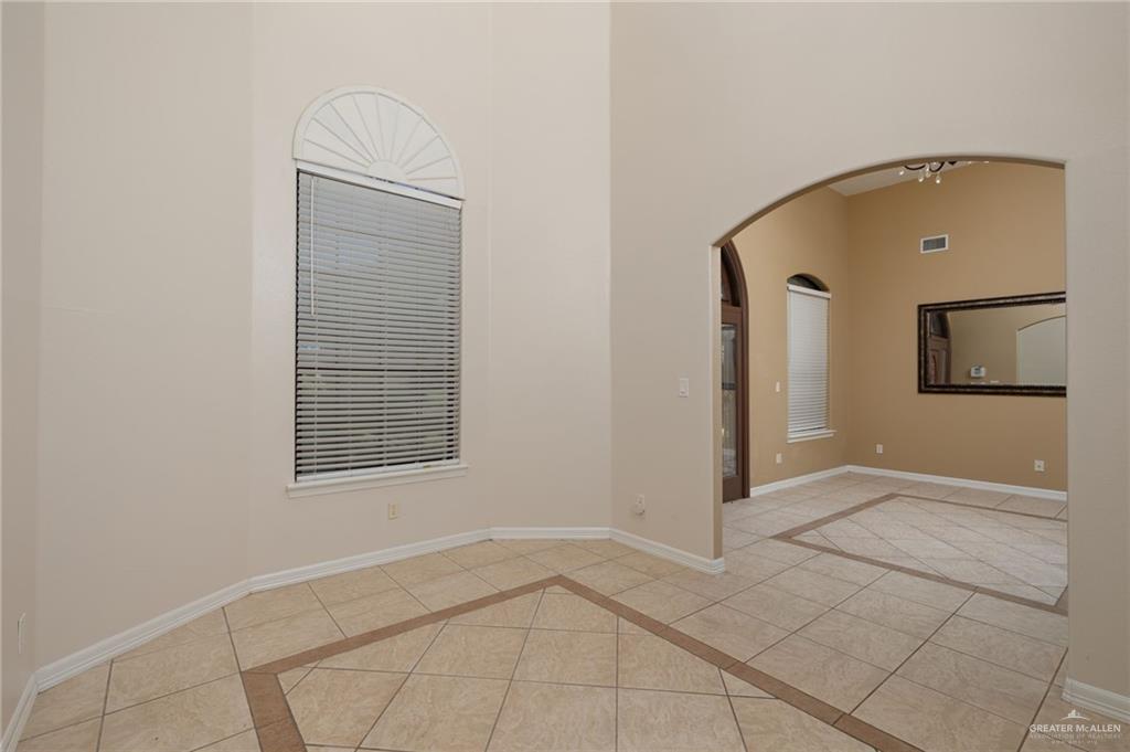 504 Orchard Court Weslaco, TX 78596 - Photo 5 of 24 an empty room with windows