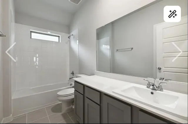 a bathroom with a granite countertop sink a toilet a mirror and shower