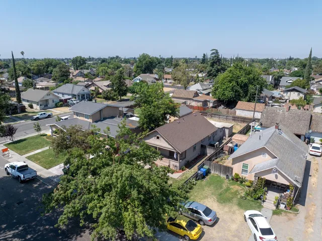 an aerial view of a house with outdoor space