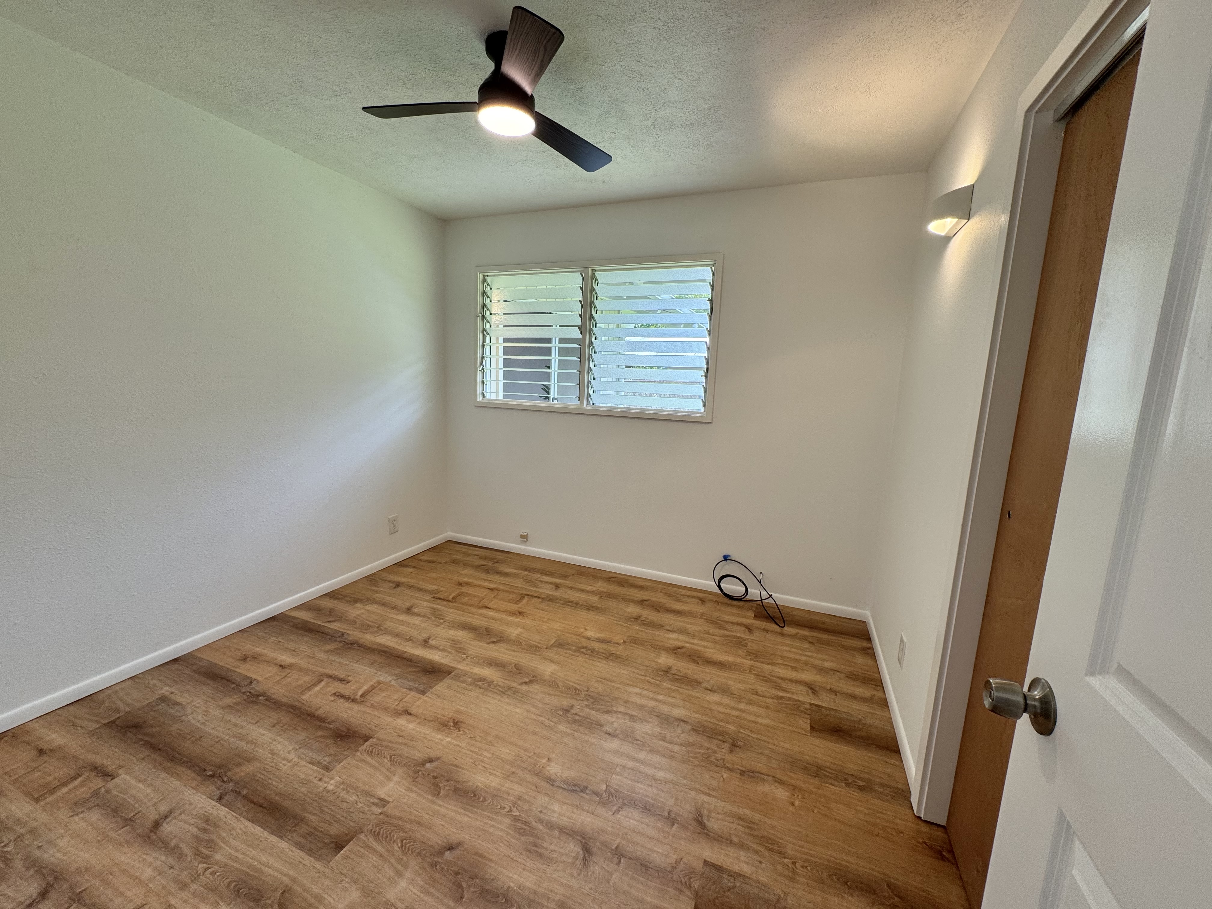 164 Likeke Street Hilo, HI 96720 - Photo 11 of 29 a view of empty room with wooden floor