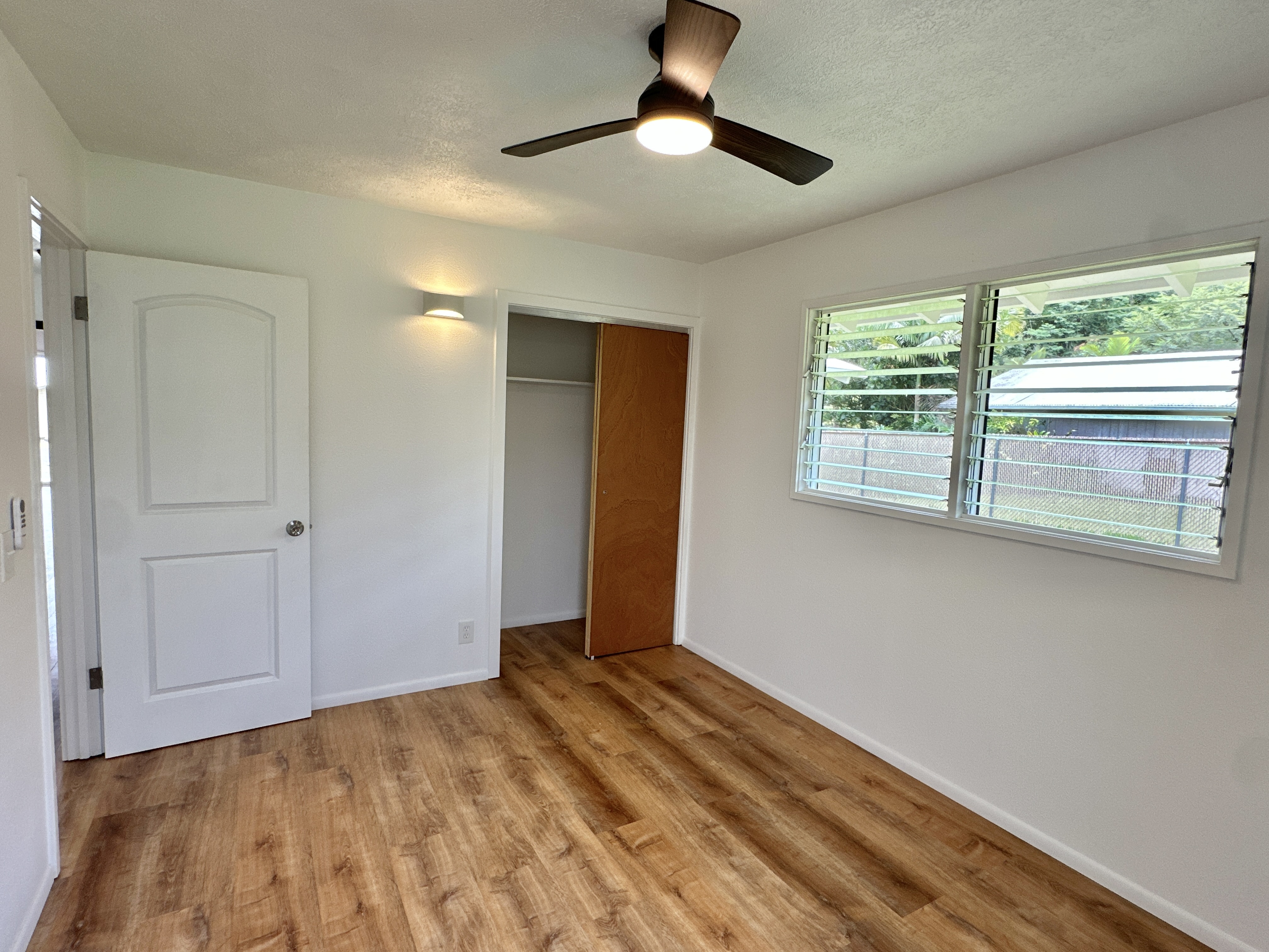164 Likeke Street Hilo, HI 96720 - Photo 13 of 29 a view of empty room with window and ceiling fan