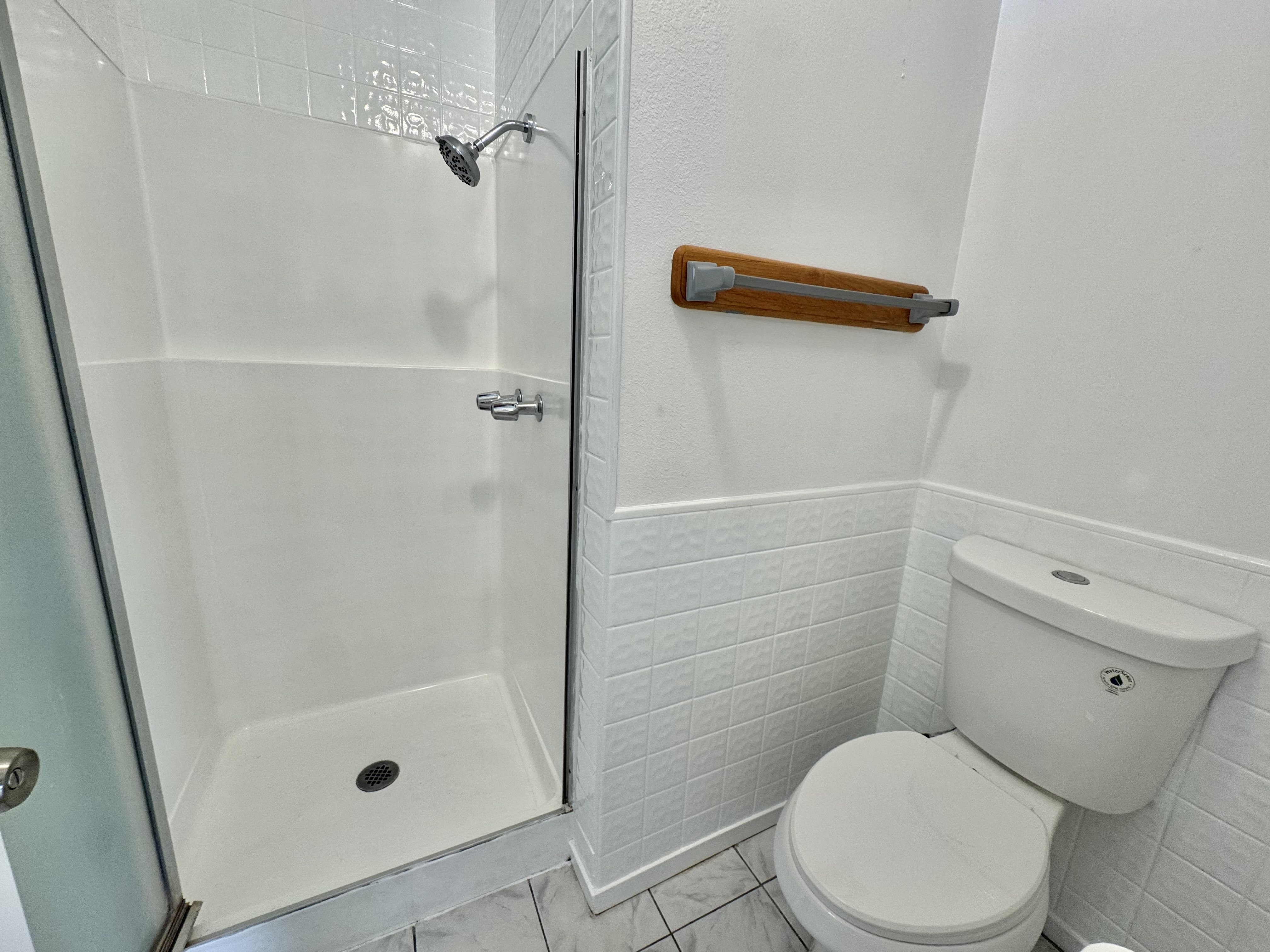 164 Likeke Street Hilo, HI 96720 - Photo 17 of 29 a white toilet sitting next to a bath tub shower