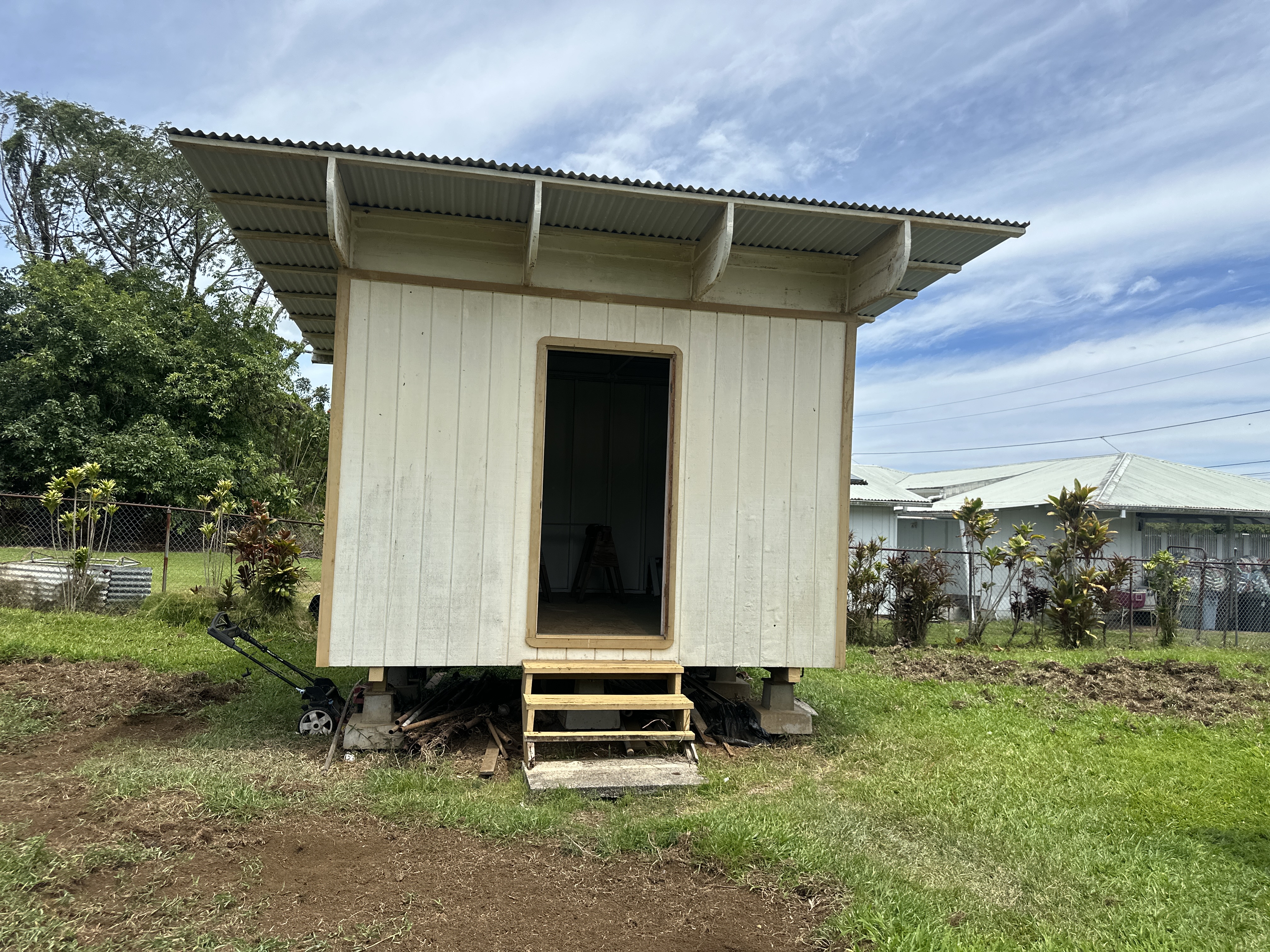 164 Likeke Street Hilo, HI 96720 - Photo 22 of 29 a front view of a house with a garden