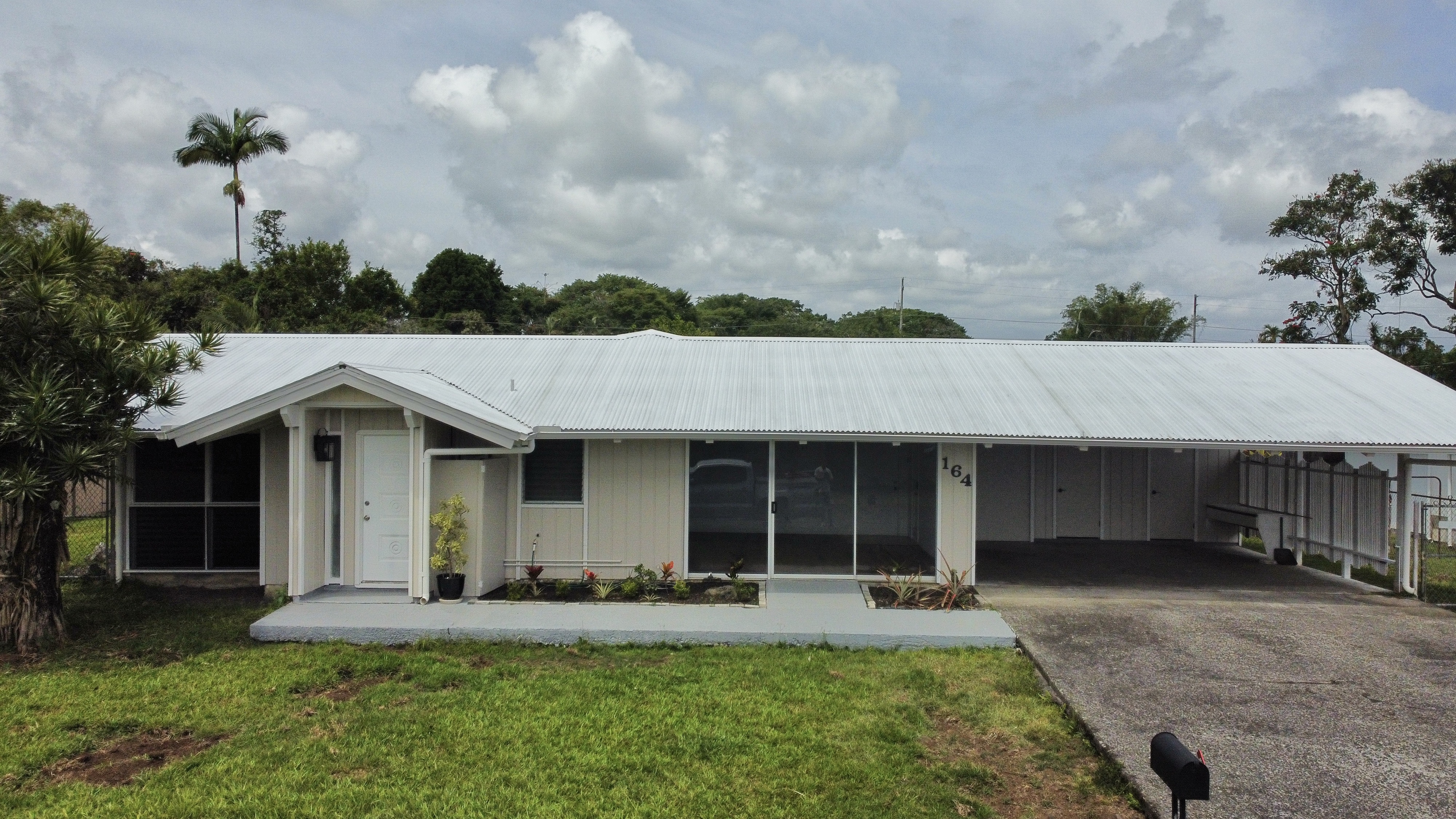 164 Likeke Street Hilo, HI 96720 - Photo 29 of 29 a front view of a house with a yard and garage