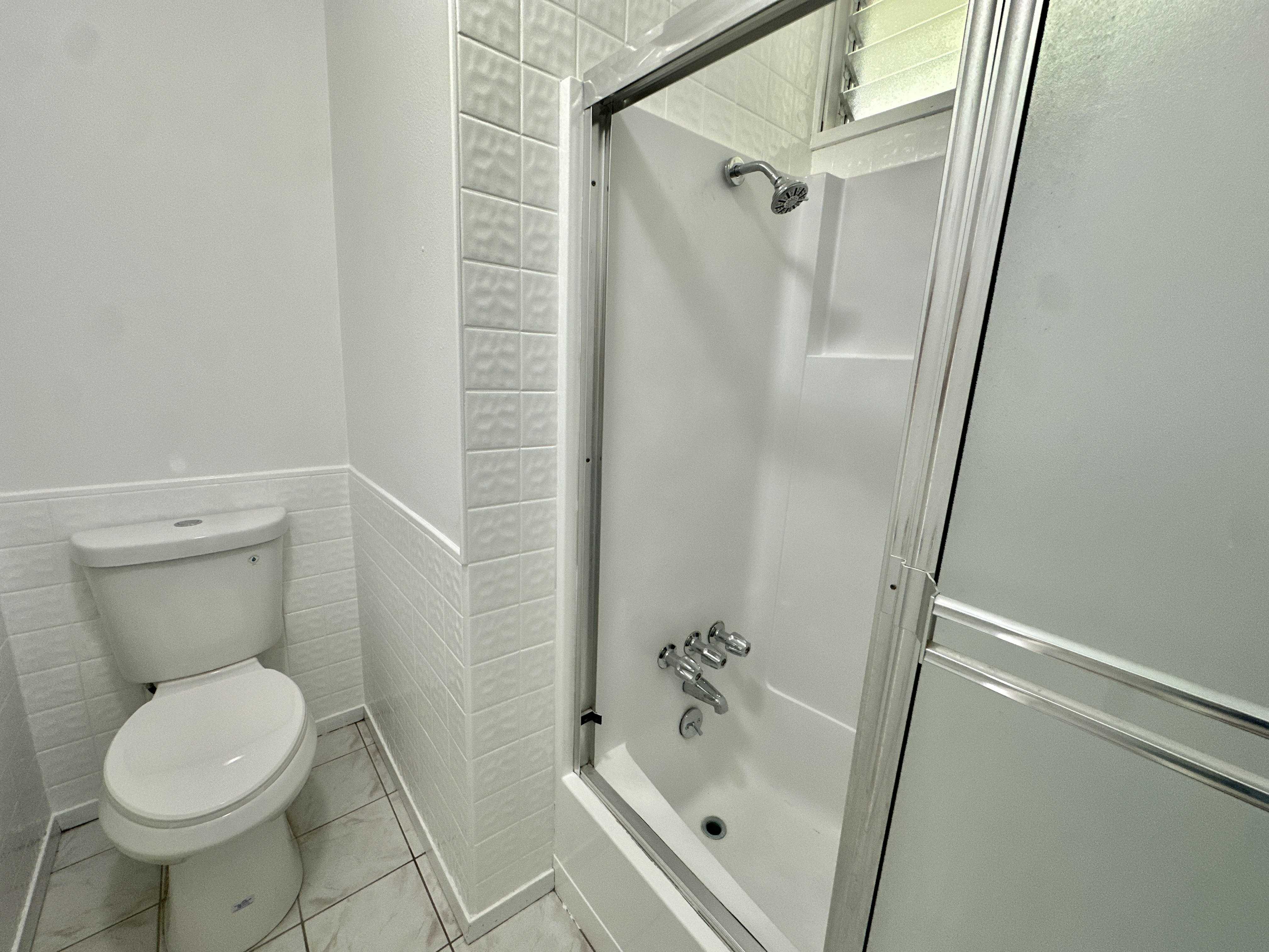 164 Likeke Street Hilo, HI 96720 - Photo 10 of 29 a bathroom with a toilet and a shower