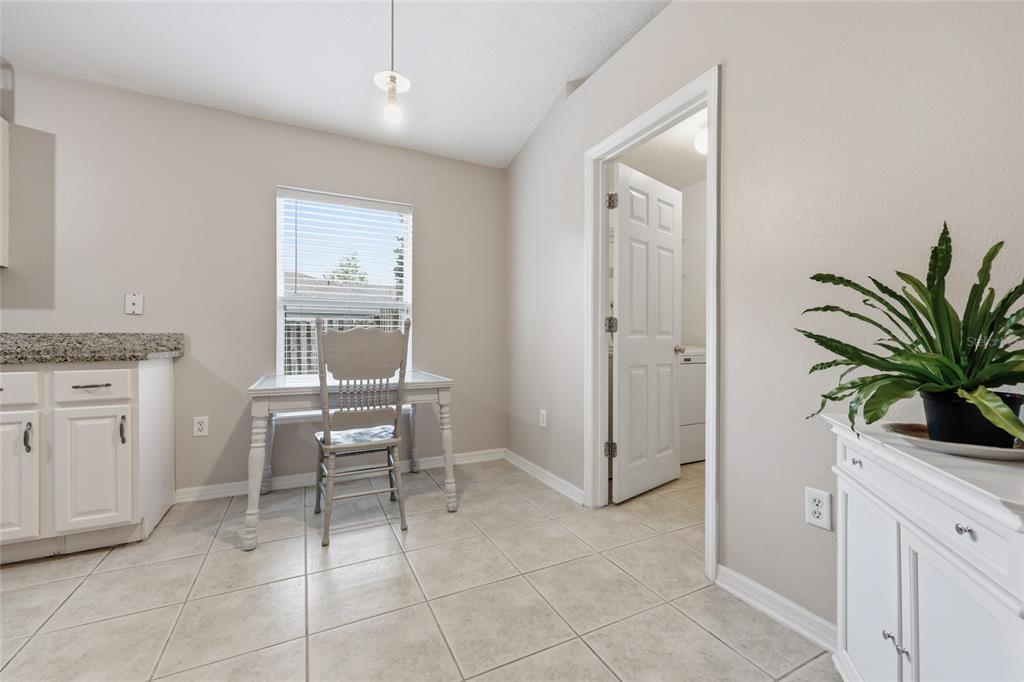23152 Northwest 11th Road Newberry, FL 32669 - Photo 13 of 31 a living room with furniture a potted plant and a window