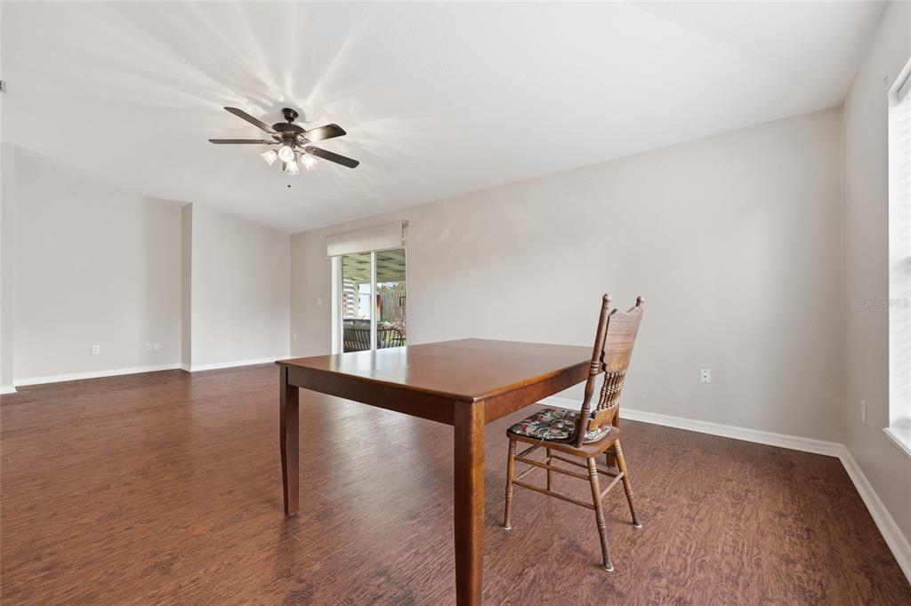 23152 Northwest 11th Road Newberry, FL 32669 - Photo 14 of 31 a view of a dining room with furniture and a window